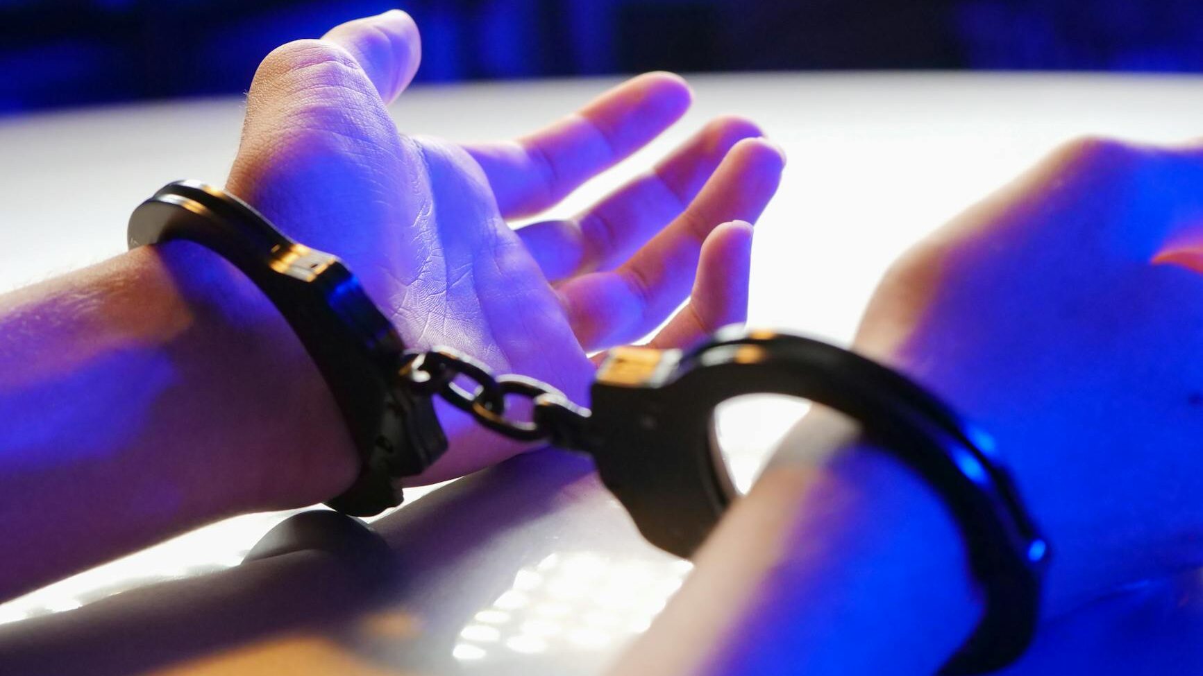 a person with black handcuffs