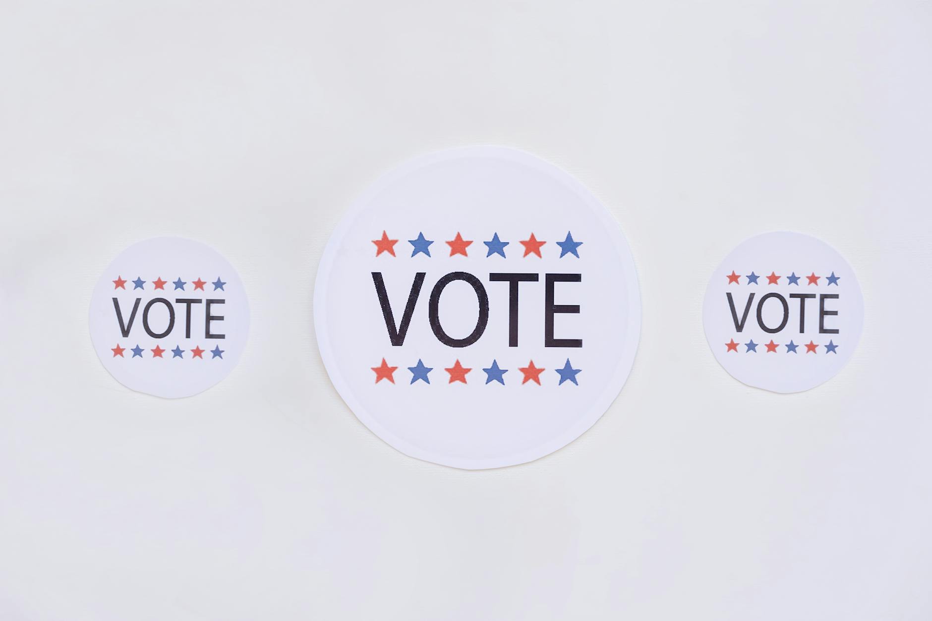 vote badges on white surface