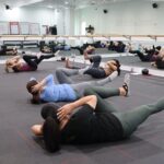 group fitness class engaged in intense core workout
