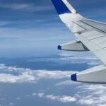 aerial view from airplane with blue wing