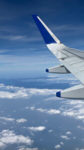 aerial view from airplane with blue wing