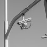monochrome surveillance camera on urban streetlight