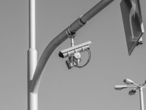 monochrome surveillance camera on urban streetlight