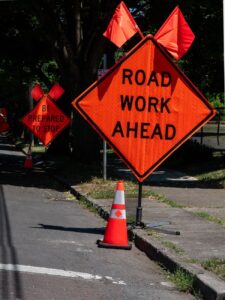 roadwork warning sign on street