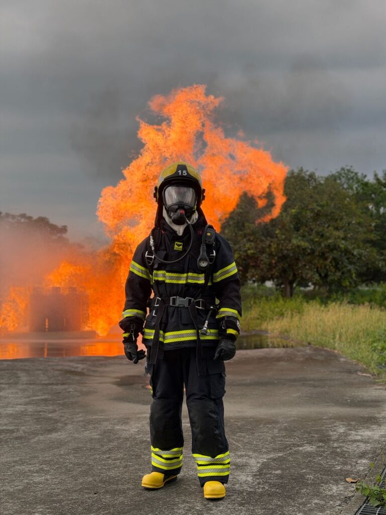 firefighter in action battling blaze